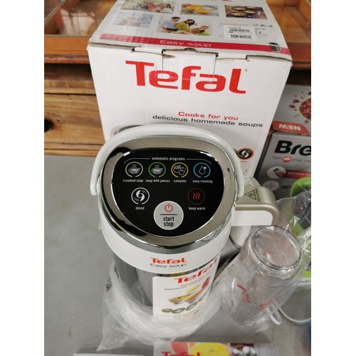 12 - A quantity of electrical kitchen items as new in boxes inc a Tefal soup maker, Morphy Richards Spira... 