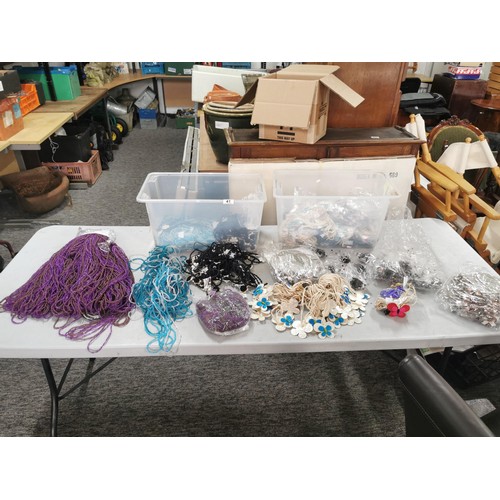 41 - 2x crates containing a large quantity of costume jewellery inc beaded necklaces, floral necklaces et... 