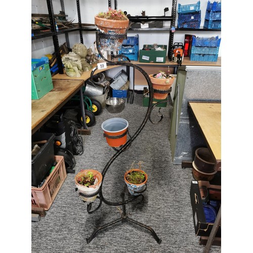 59 - 5 tier wrought iron plant stand containing 3x terracotta plant pots and one other stands 132cm high