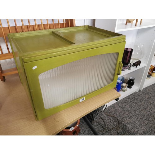 108 - Green vintage Remploy kitchen cupboard with ribbed glass revealing a single shelf 39cm high, 59cm lo... 