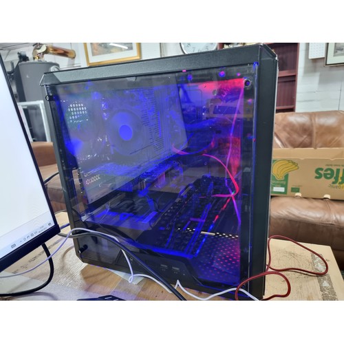 141 - A full gaming pc setup which includes a custom gaming case with RGB lighting with Microsoft windows ... 