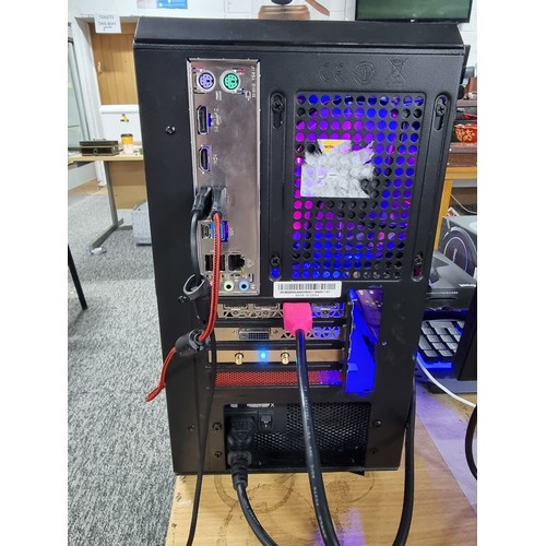 141 - A full gaming pc setup which includes a custom gaming case with RGB lighting with Microsoft windows ... 