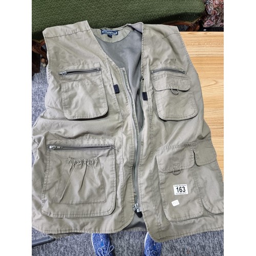 163 - 2x gents fishing vests along with a Ron Thompson fish bait bum bag tray. The vests are size medium a... 