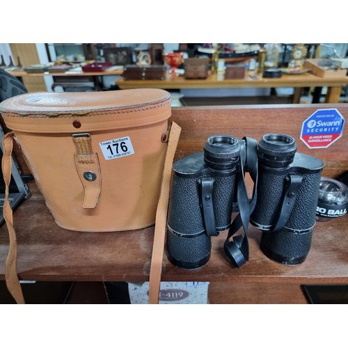 176 - A large pair of vintage Carl Zeiss Jena Jenoptem 10x50 binoculars in a good leather binoculars case.