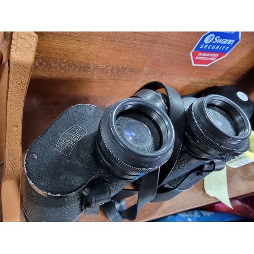 176 - A large pair of vintage Carl Zeiss Jena Jenoptem 10x50 binoculars in a good leather binoculars case.