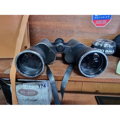 176 - A large pair of vintage Carl Zeiss Jena Jenoptem 10x50 binoculars in a good leather binoculars case.