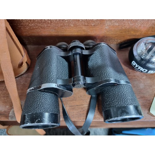 176 - A large pair of vintage Carl Zeiss Jena Jenoptem 10x50 binoculars in a good leather binoculars case.