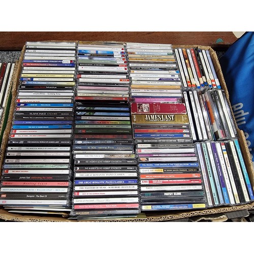 178 - A large collection in 4 boxes of DVD's and CD's to include 2 boxes full of DVD's and 2 boxes full of... 