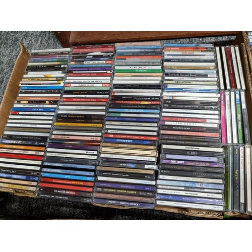 178 - A large collection in 4 boxes of DVD's and CD's to include 2 boxes full of DVD's and 2 boxes full of... 