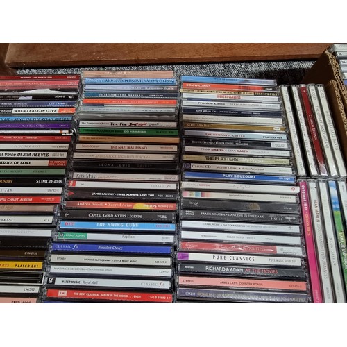 178 - A large collection in 4 boxes of DVD's and CD's to include 2 boxes full of DVD's and 2 boxes full of... 