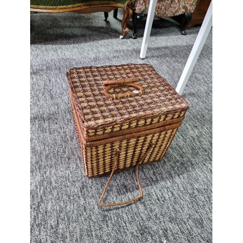 187 - 2 wicker picnic baskets with contents along with a wicker dog bed and 2 large solid wood carved ethn... 