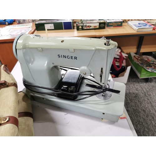 213 - Vintage electric Singer sewing machine in original carry case  complete with foot pedal and instruct... 