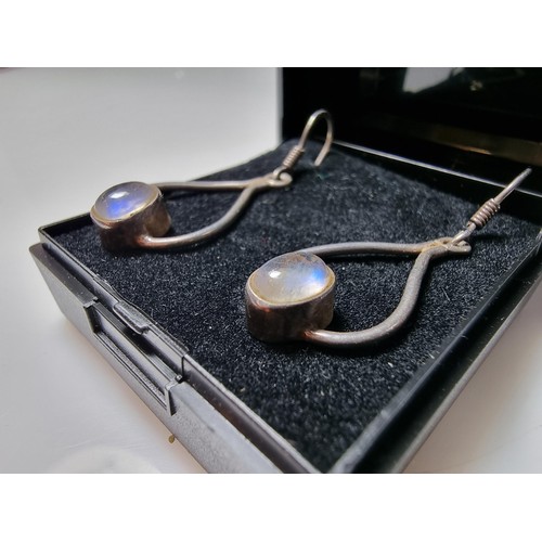 291 - 925 silver drop earrings inset with Spectrolite stones presenting blue flashing colours, marked 925.... 