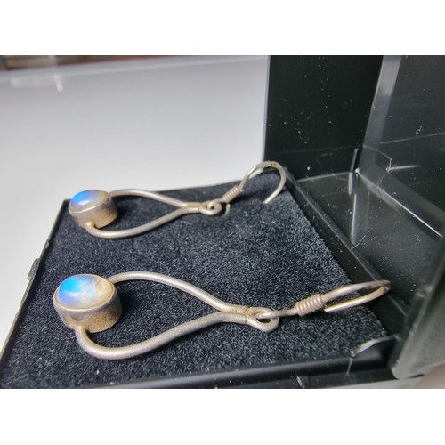 291 - 925 silver drop earrings inset with Spectrolite stones presenting blue flashing colours, marked 925.... 