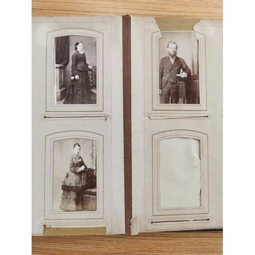 230 - 2x Victorian photo albums each containing a quantity of photographs from the period, predominately p... 