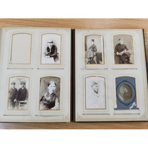 230 - 2x Victorian photo albums each containing a quantity of photographs from the period, predominately p... 