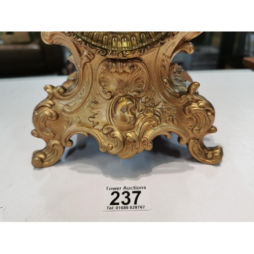 237 - Vintage french gilded Ansonia 8 day mantel clock striking on a bell for the hour and half hour, with... 