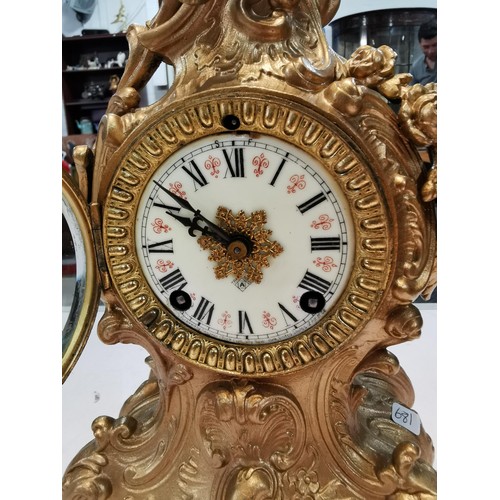 237 - Vintage french gilded Ansonia 8 day mantel clock striking on a bell for the hour and half hour, with... 