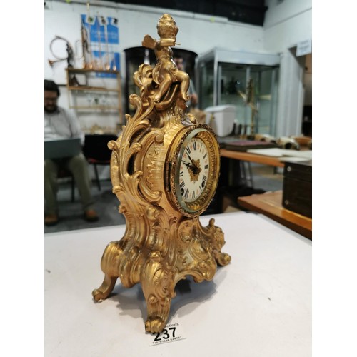 237 - Vintage french gilded Ansonia 8 day mantel clock striking on a bell for the hour and half hour, with... 