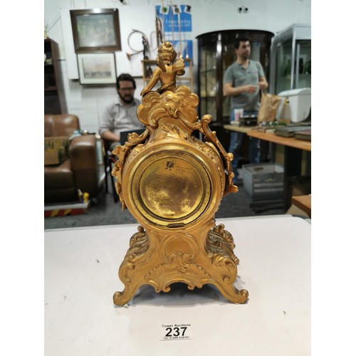 237 - Vintage french gilded Ansonia 8 day mantel clock striking on a bell for the hour and half hour, with... 