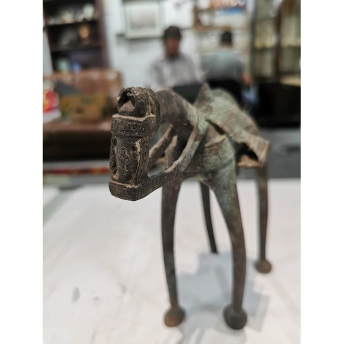 240 - Antique bronze figure of a camel, with detailing to the saddle, with damage to the leg and tail