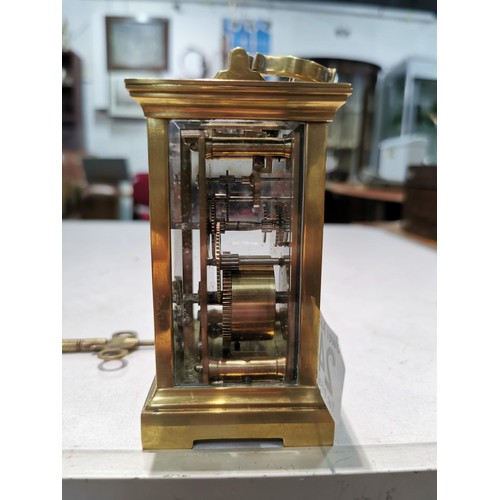 241 - Good quality early vintage brass carriage clock with a visible escapement to the top bevel edge glas... 