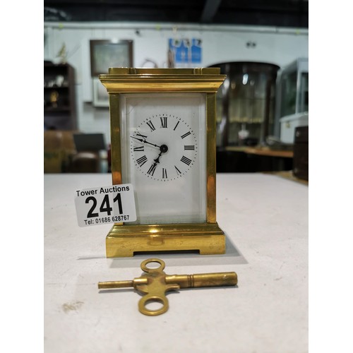 241 - Good quality early vintage brass carriage clock with a visible escapement to the top bevel edge glas... 