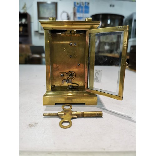 241 - Good quality early vintage brass carriage clock with a visible escapement to the top bevel edge glas... 