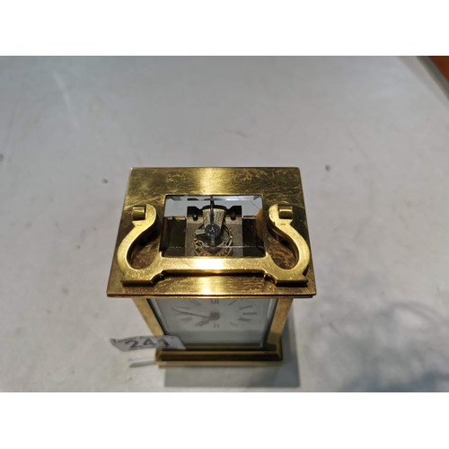 241 - Good quality early vintage brass carriage clock with a visible escapement to the top bevel edge glas... 