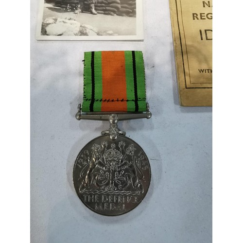 242 - Vintage Id card and defence medal for WWII for Fred Sutton along with a battle of Britain booklet au... 