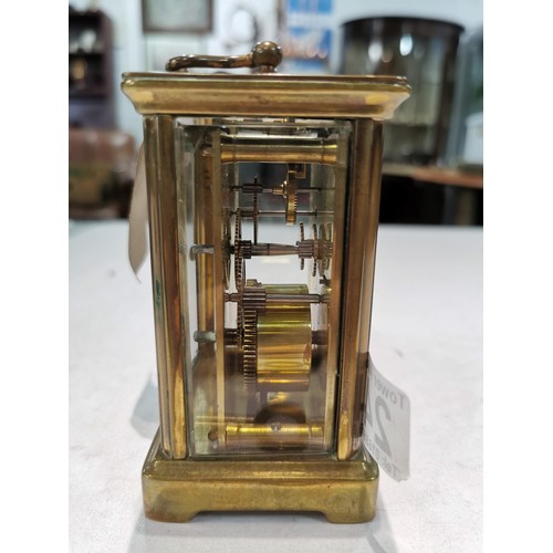 243 - Good quality early vintage brass carriage clock with a visible escapement to the top bevel edge glas... 