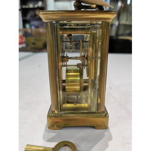 243 - Good quality early vintage brass carriage clock with a visible escapement to the top bevel edge glas... 