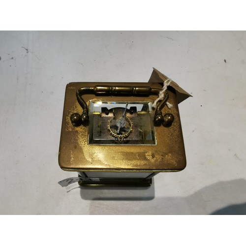 243 - Good quality early vintage brass carriage clock with a visible escapement to the top bevel edge glas... 