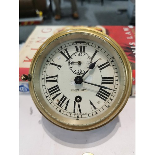 244 - Vintage brass ships clock G.Falconer (H-K) ltd Hong Kong. with bevelled edged glass and enamel dial