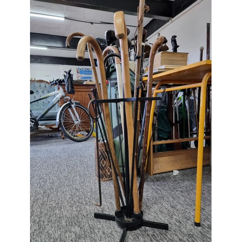 205 - Metal umbrella formed walking stick / umbrella stand containing 8x various walking sticks. All in go... 