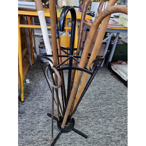 205 - Metal umbrella formed walking stick / umbrella stand containing 8x various walking sticks. All in go... 