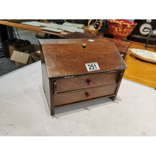 251 - Small vintage oak table top desk bureau, with pull down writing slope and two drawers to the base bo... 