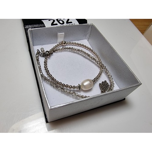 262 - 2x 925 silver bracelets, 1 inset with a large pearl, both marked 925 in clean condition boxed.