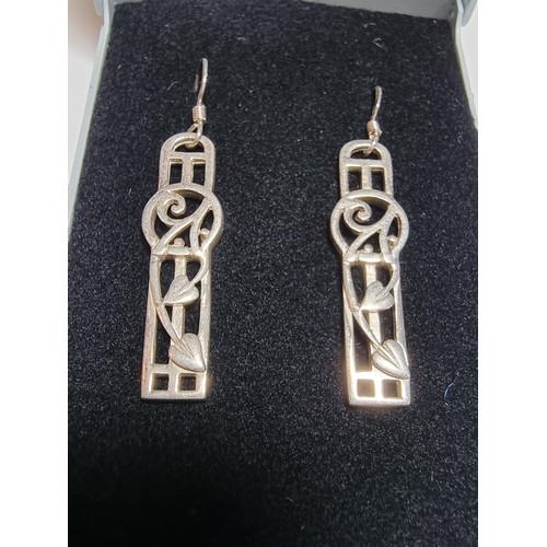 270 - A pair of long drop 925 silver earrings in the Rennie Mackintosh design, in good clean condition, bo... 