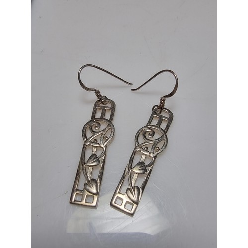 270 - A pair of long drop 925 silver earrings in the Rennie Mackintosh design, in good clean condition, bo... 