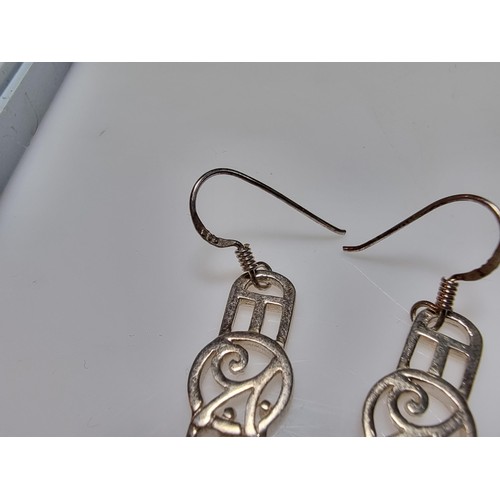 270 - A pair of long drop 925 silver earrings in the Rennie Mackintosh design, in good clean condition, bo... 