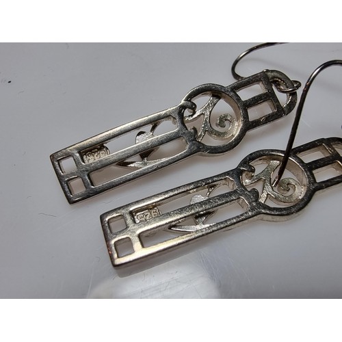 270 - A pair of long drop 925 silver earrings in the Rennie Mackintosh design, in good clean condition, bo... 