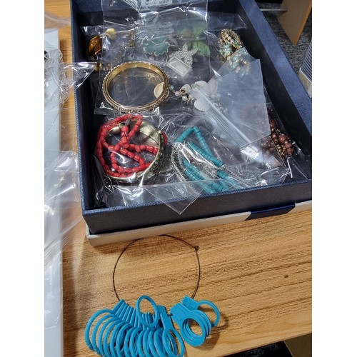 274 - A box full of various good quality costume jewellery all individually packaged along with a finger r... 