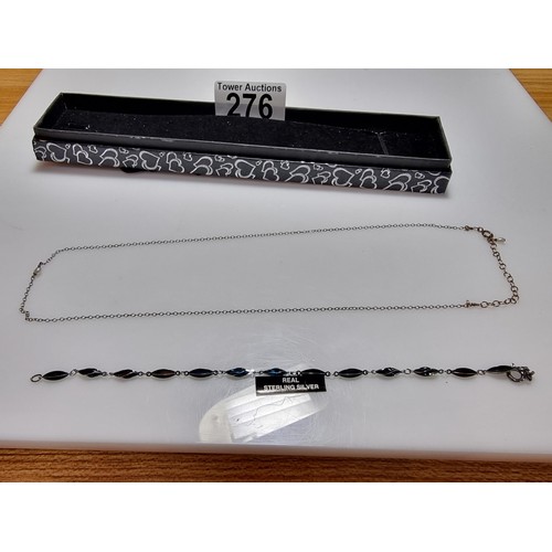 276 - A 925 silver bracelet with a blued colour along with a 925 silver necklace with a pearl.