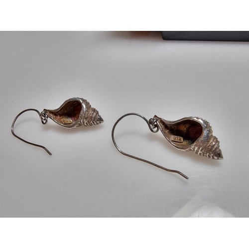 277 - A pair of 925 silver shell formed drop earrings in excellent clean condition, 2.5cm drop, marked 925... 