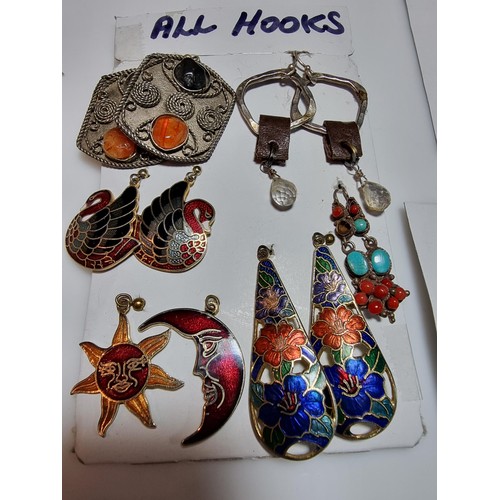 282 - A quantity of pretty earrings along with 3 brooches and a necklace inset with tigers eye and sun sto... 