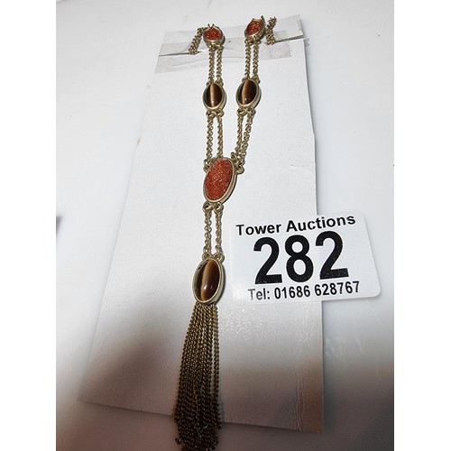 282 - A quantity of pretty earrings along with 3 brooches and a necklace inset with tigers eye and sun sto... 