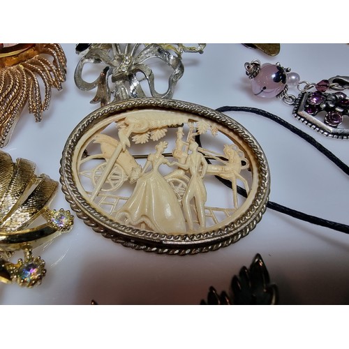 293 - A box full of good quality costume jewellery to include a large suite of various brooches, various e... 