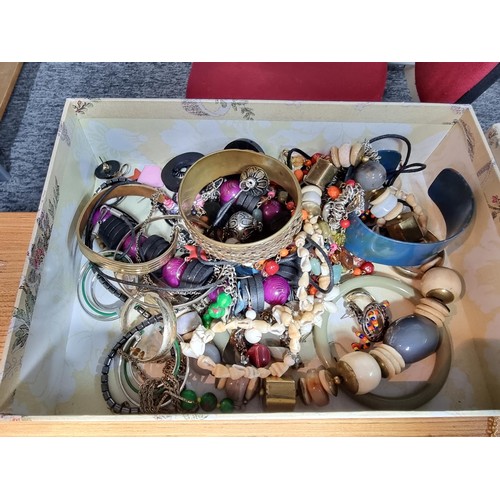 293 - A box full of good quality costume jewellery to include a large suite of various brooches, various e... 