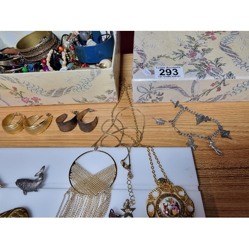 293 - A box full of good quality costume jewellery to include a large suite of various brooches, various e... 